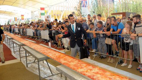 1.5km of deliciousness: World’s longest pizza served up in Milan