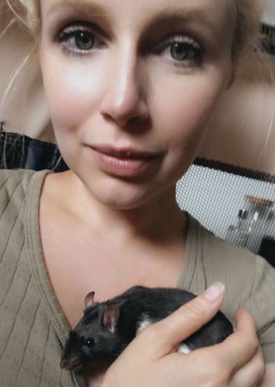 Christine Savanah cuddles her pet rat Winston.
