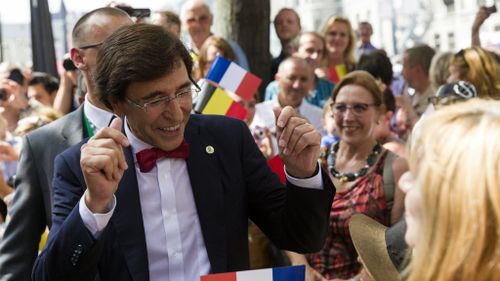 Belgian Prime Minister Elio Di Rupo greets crowds. (AAP)