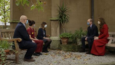 Prince William and his wife Kate the Duchess of Cambridge meet medical staff, from left, Head of Pharmacy Sotiris Antoniou, Respiratory Physio Isobel Fale and Medical Oncology Trainee and Chief Registrar Dr Myria Galazi, as they visit St. Bartholomew's Hospital in London, to mark the launch of the nationwide 'Hold Still' community photography project, Tuesday, Oct. 20, 2020