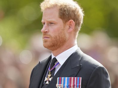 Prince Harry follows the coffin of Queen Elizabeth II during a procession from Buckingham Palace to Westminster Hall in London, Wednesday, Sept. 14, 2022.  