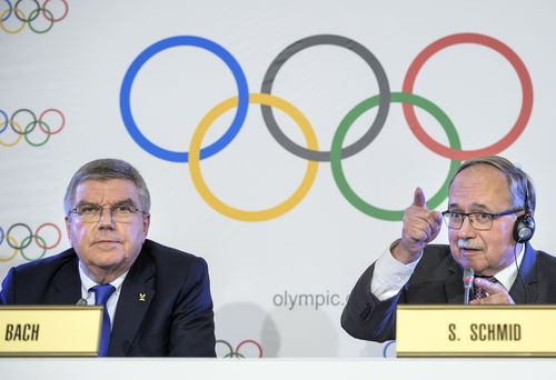 Thomas Bach and Samuel Schmid speak at the press conference announcing Russia'a Winter Olympics.
