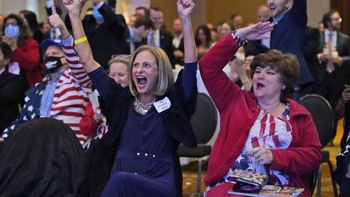 A supporter of Republican candidate for Senate US Senator David Perdue, cheers as Fox News called Florida for President Trump during an election-night watch party.