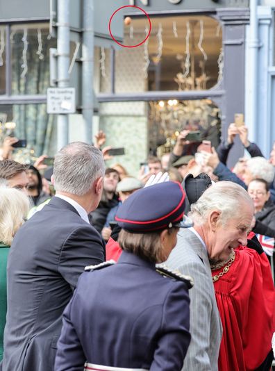 An egg (circled) is thrown by a member of the public as King Charles III and Camilla, Queen Consort arrive for the Welcoming Ceremony to the City of York at Micklegate Bar during an official visit to Yorkshire on November 09, 2022 in York, England.