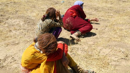 Thousands of Yezidis were trapped in the Sinjar mountains as they tried to escape from Islamic State (IS) forces. (Getty Images)