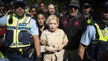Anti-trans activist Kellie-Jay Keen, aka Posie Parker, was escorted out of Albert Park by police.