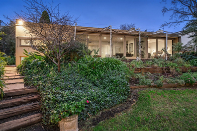 A rare riverfront property in Melbourne's Kew is selling for $5 million at auction.
