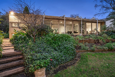 Rare riverfront property in Melbourne's Kew sells for $5million at auction.