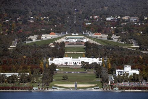 Parliament House (at rear) is the largest building in the southern hemisphere. (AAP)