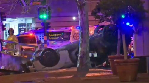 Three people have been killed in a fiery car accident in Sydney's CBD.