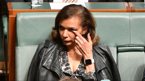 Labor MP Anne Aly wipes away tears.