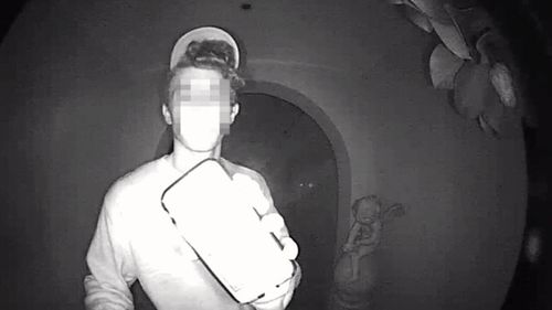 This late night intruder was caught trying to break into a home.