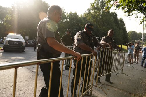 Authorities put up barricades outside of the Fulton County Jail, Thursday, Aug. 24, 2023, in Atlanta. 