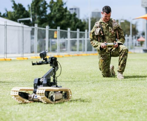 Police and ADF members have been given additional powers to conduct random searches and patrol airport-like security across 15 venues around the Gold Coast. Picture: AAP.