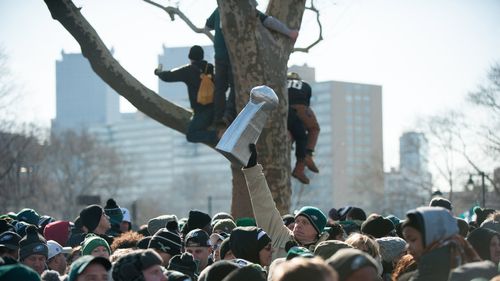 Eagles fans lined the streets in freezing conditions before dawn
(AAP).