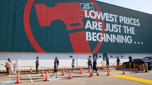 People wait at Bunnings at Rockdale.