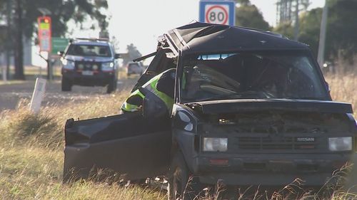 A woman is fighting for her life after a fatal crash in Dalby