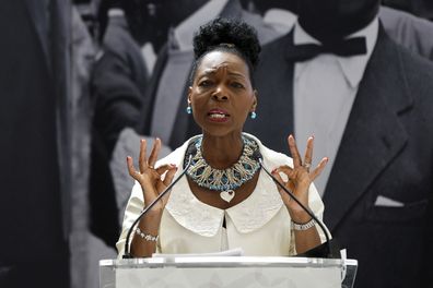 Baroness Floella Benjamin speaks during the unveiling of the National Windrush Monument at Waterloo Station in London, Wednesday, June 22, 2022. The unveiling of the statue - of a man, woman and child in their Sunday best standing on top of suitcases on Wednesday will mark Windrush Day. (John Sibley/Pool Photo via AP)