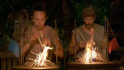 Sarah Lucina and Tony Vlachos in the final fire-making challenge as seen on Survivor: Winners At War in 2020. 