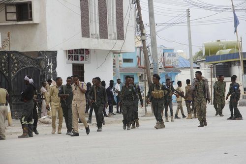 Soldiers patrol outside the Hayat Hotel in Mogadishu, Somalia, Saturday Aug, 20, 2022. 