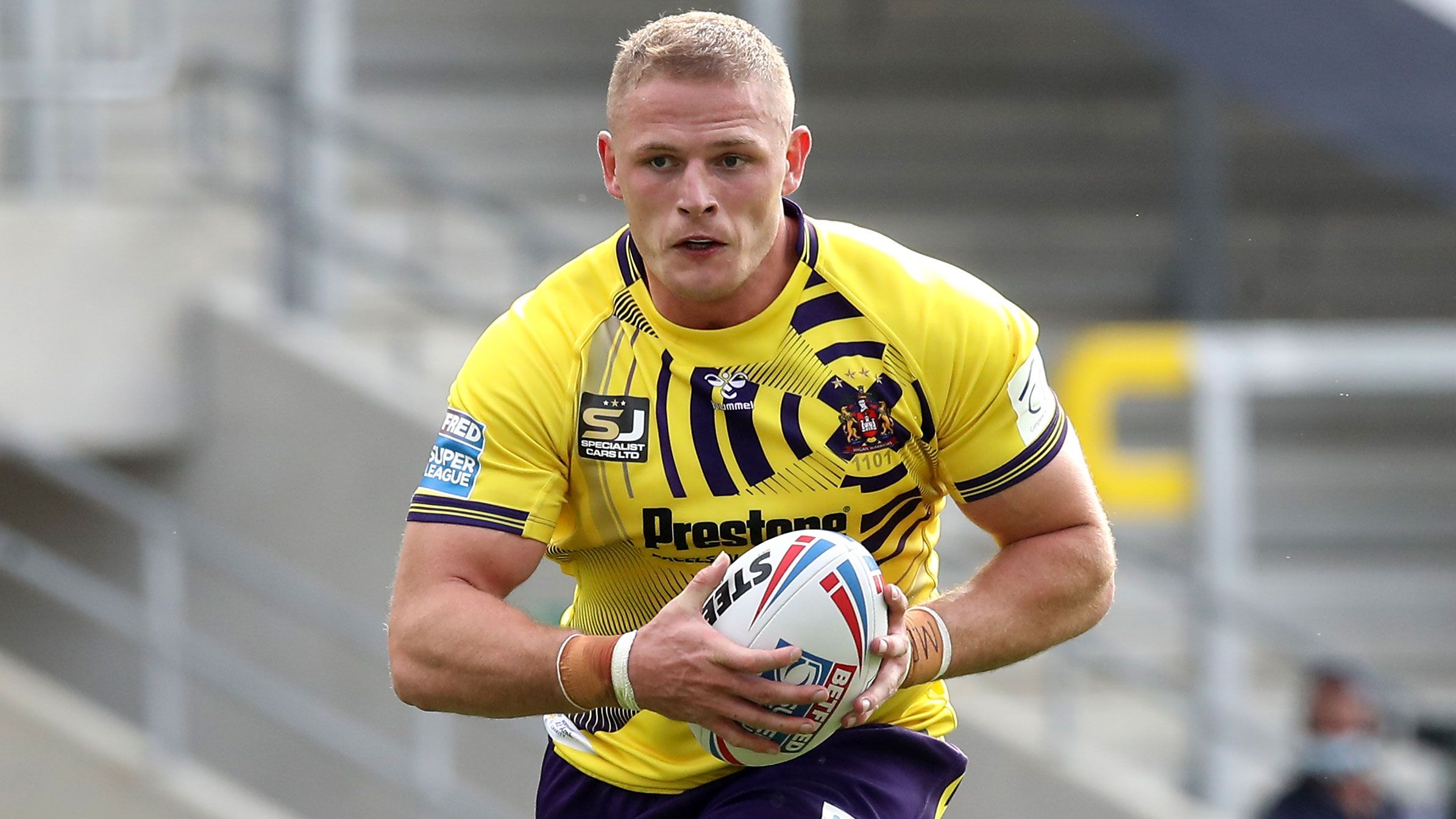 George Burgess runs the ball during his brief stint with Wigan.