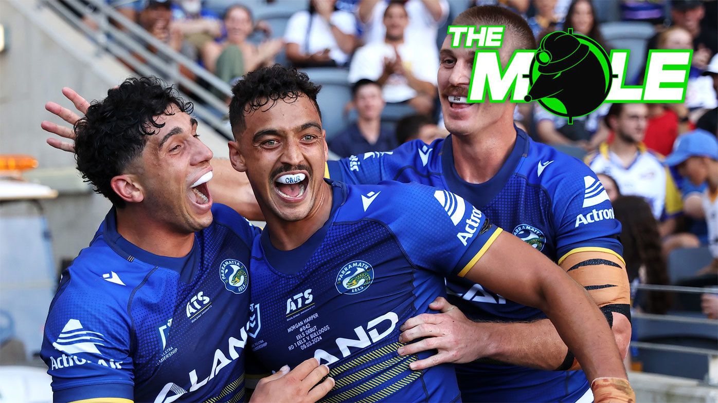 Eels players Bailey Simonsson, Morgan Harper and Shaun Lane celebrate a try in their round one win against the Bulldogs.