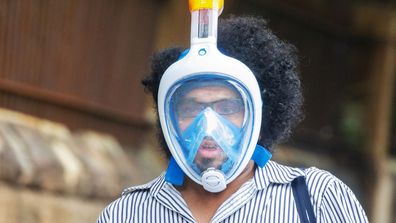 A person wearing a snorkel and mask is seen on March 26, 2020 in Sydney
