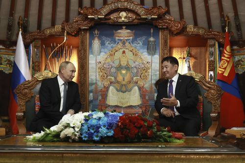 Russian President Vladimir Putin, left; Mongolian President Ukhnaagiin Khurelsukh, right.