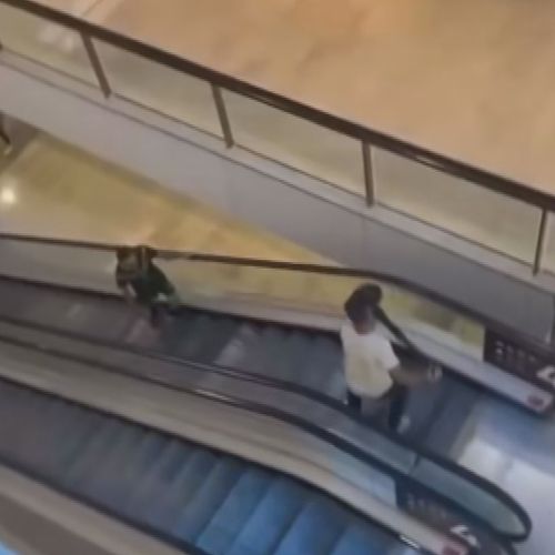 V﻿ideo has emerged of a shopper confronting a man, who was armed with a knife, with a bollard on an escalator at a bondi junction westfield