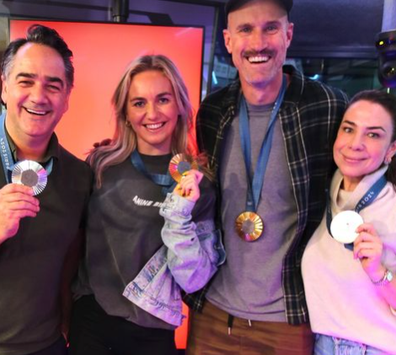 Radio hosts Fitzy, Wippa and Kate with swimming champion Ariane Titmus and her Paris 2024 gold medals