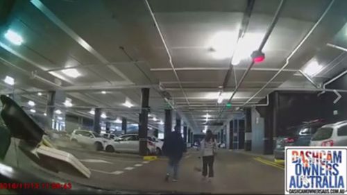 The man and woman were walking through a car park when they were beeped at. (Dashcam Owners Australia/Facebook)