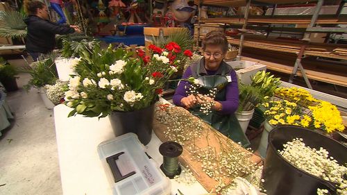 Blaire Ringwaldt's team preparing dozens of bouquets. 