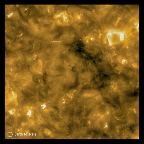 The arrow indicates a small "campfire" with the scale of the Earth marked in the lower left corner. (Image credit: Solar Orbiter/EUI Team/ESA & NASA; CSL, IAS, MPS, PMOD/WRC, ROB, UCL/MSSL)