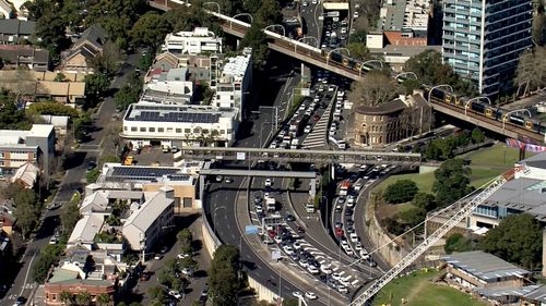 Heavy delays north and southbound after car burst into flames inside Sydney Harbour Tunnel. 