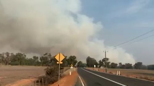 A bushfire threatened homes in GinGin, almost 70km north of Perth, WA.