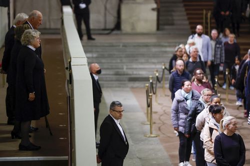 Norway's King Harald pays his respects to the coffin of Britain's Queen Elizabeth, following her death, during her lying-in-state at Westminster Hall, in London, Sunday Sept. 18, 2022. (John Sibley/Pool via AP)