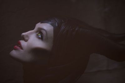 Angelina Jolie stars as the villainous Maleficent, in this re-telling of the classic <i>Sleeping Beauty</i> tale that looks at the events that hardened her heart and drove her to curse young Princess Aurora (Elle Fanning).<br/><br/>(Image: Disney)