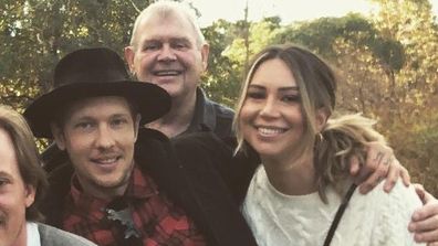 John Farnham&#x27;s eldest son Rob Farnham announces engagement to girlfriend Melissa Kelly. Rob and Melissa on far right, hugged by John, in the back row.