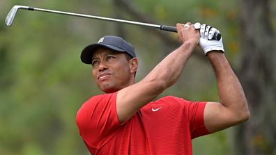 Tiger Woods watches his tee shot on the fourth hole during the final round of the PNC Championship golf tournament in Orlando.