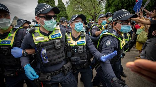 Protesters and members of Victoria Police clash on October 23, 2020 in Melbourne, Australia