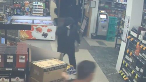 The thieves have worn black balaclavas and hoodies at each robbery. (Victoria Police)