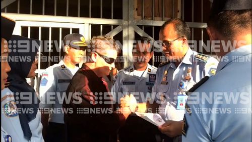 Lawrence then shook hands for the final time with officials inside the Bangli Prison.