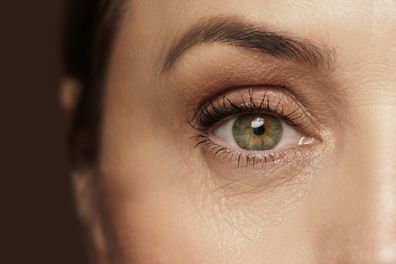 Closeup of aged female eye with wrinkled skin