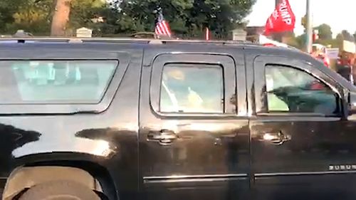 President Donald Trump declared, "I get it," in a message to the nation Sunday evening before briefly leaving the hospital to salute cheering supporters from his motorcade.