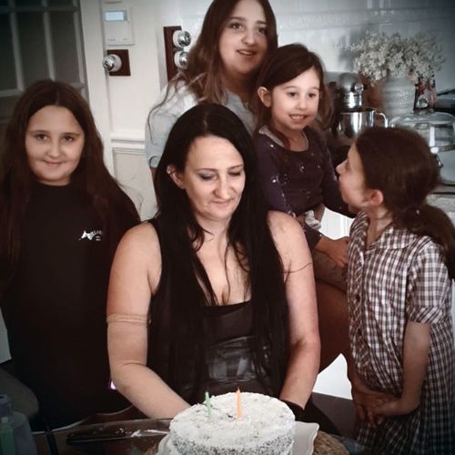 Amanda Stacey, pictured with her two daughters and nieces on her birthday this year.