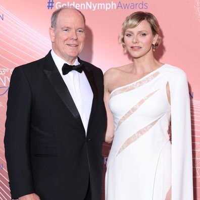 Albert II, Prince of Monaco and Charlene, Princess of Monaco on stage speaking at the closing ceremony during the 63rd Monte-Carlo Television Festival