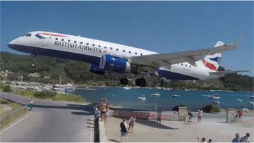 A group of holidaymakers had a close call when a British Airways plane narrowly missed their heads while landing on the Greek island of Skiathos. 