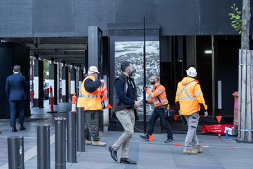 Workers outside the Reserve Bank of Australia.