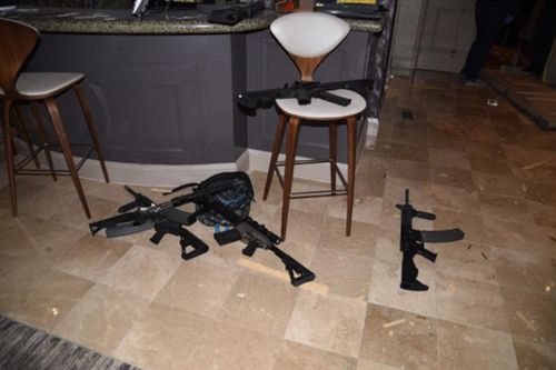 A number of guns can be seen littering the floor of the hotel room. Image: Las Vegas Metropolitan Police Department