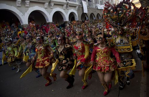 The spectacle draws thousands of onlookers and tourists from across the globe. (AP)